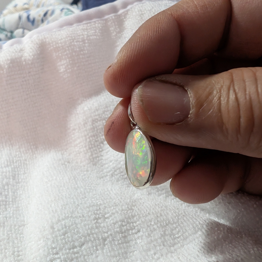 Elegant Ethiopian Opal Pendant in Silver Setting - Picture 3 of 5